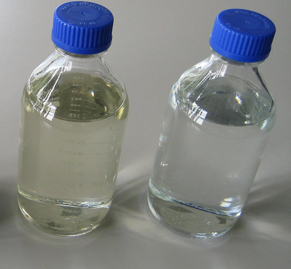 Image of water samples in glass bottles.